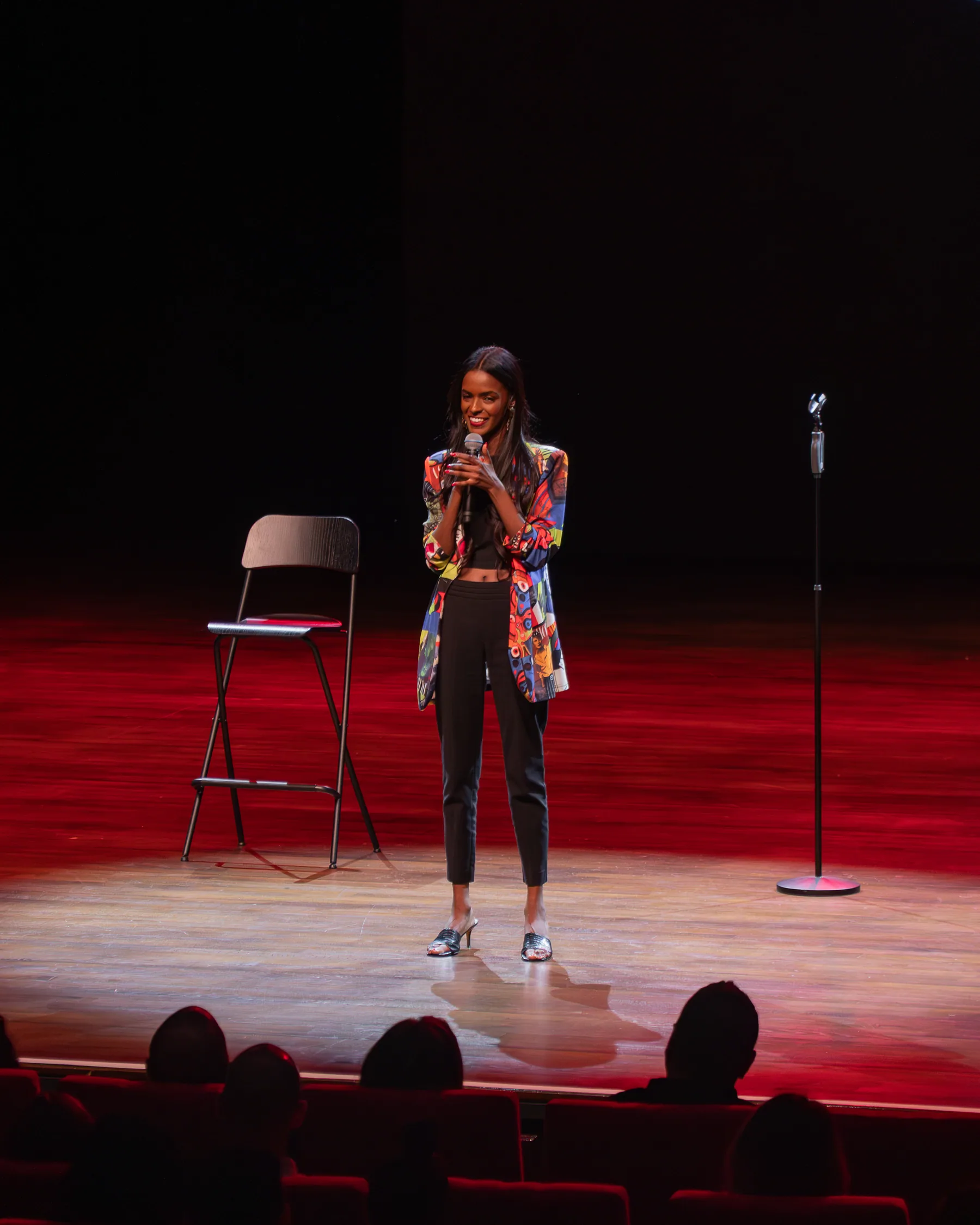 Sahar Ali addressing an audience from the stage