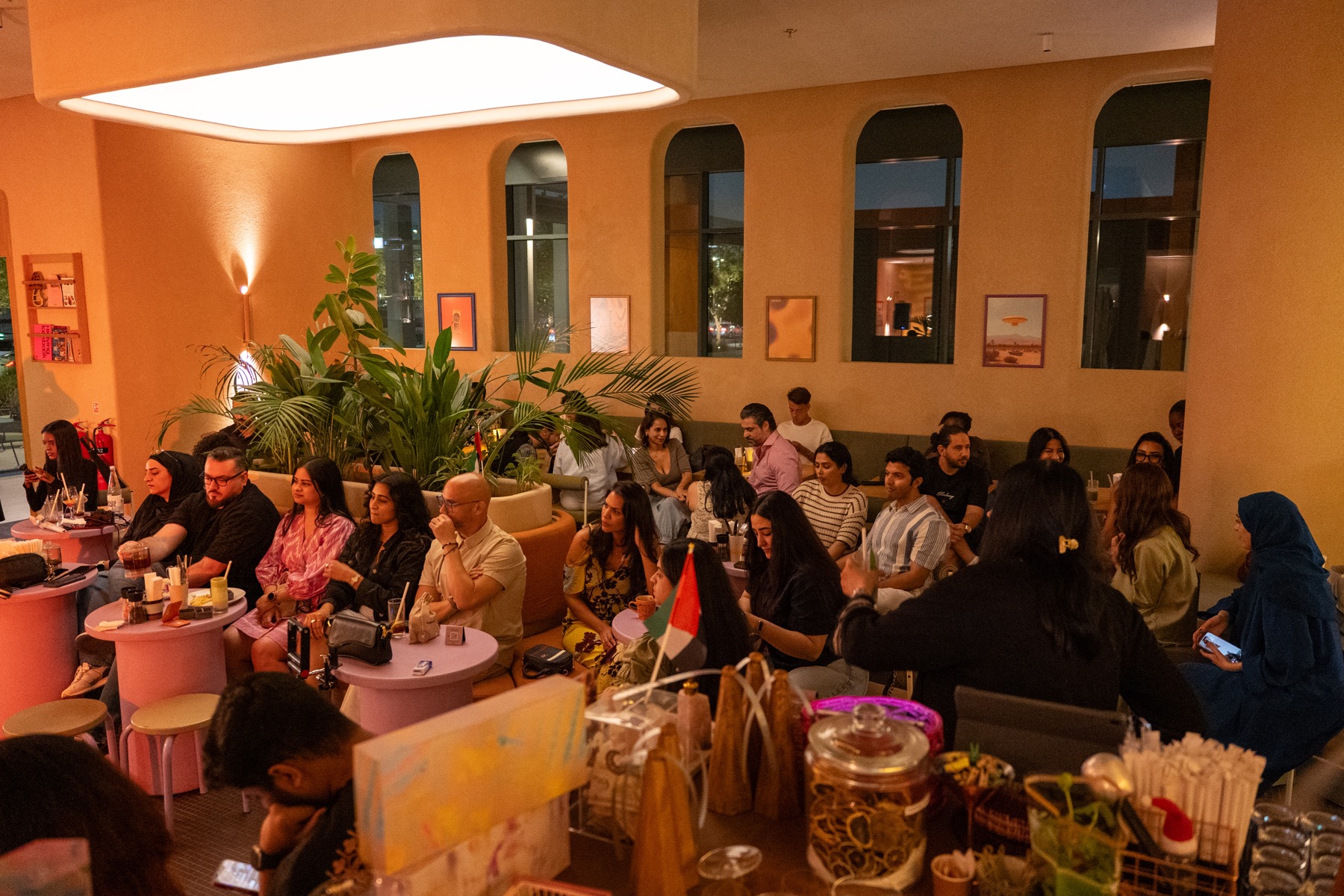 A full room of guests watching the live programme