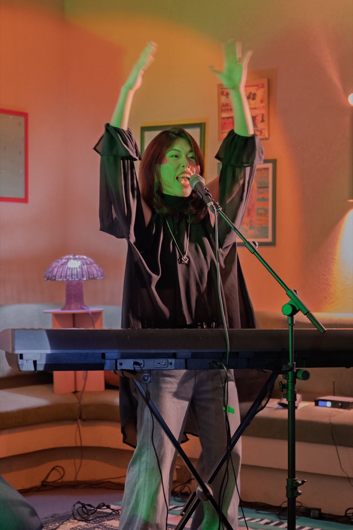 A keyboard player encouraging the audience